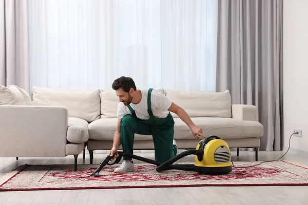 depositphotos_675464188-stock-photo-dry-cleaner-employee-hoovering-carpet